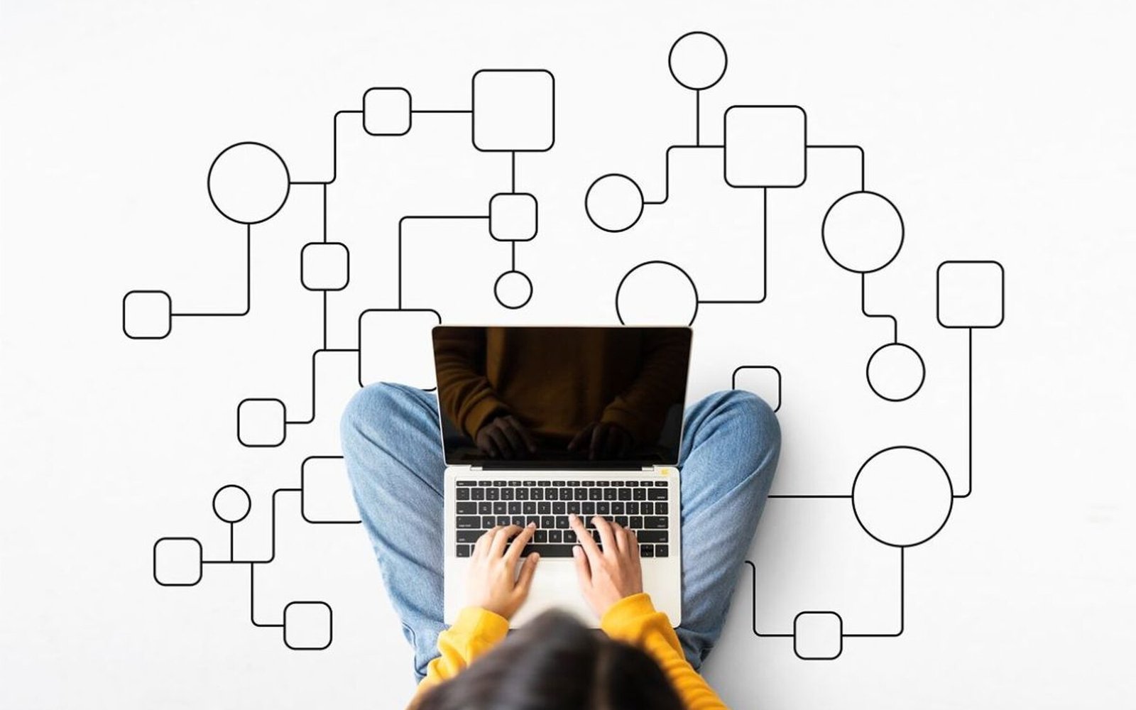 Researcher working on a laptop surrounded by a connected workflow diagram